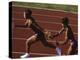Female Runner Competing in a Relay Track Race-null-Premier Image Canvas