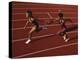 Female Runner Competing in a Relay Track Race-null-Premier Image Canvas