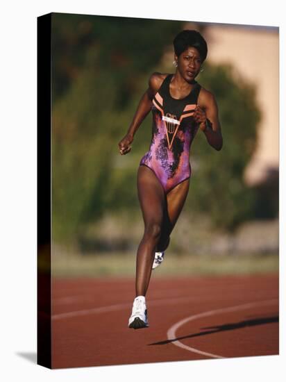 Female Runner Competing in a Track Race-null-Premier Image Canvas