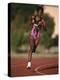 Female Runner Competing in a Track Race-null-Premier Image Canvas