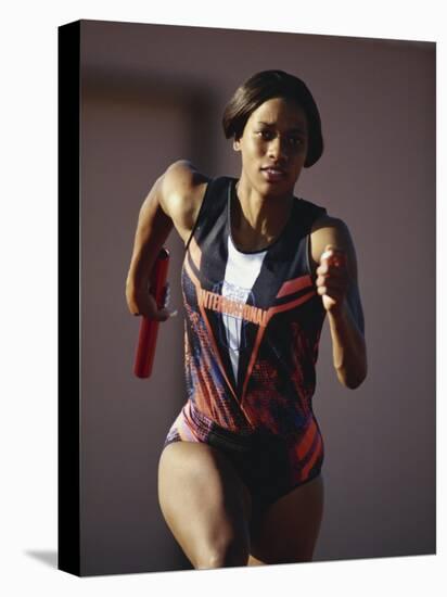 Female Runner Competing in a Track Race-null-Premier Image Canvas