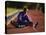 Female Runner Stretching While Training on the Track-null-Premier Image Canvas