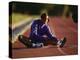 Female Runner Stretching While Training on the Track-null-Premier Image Canvas