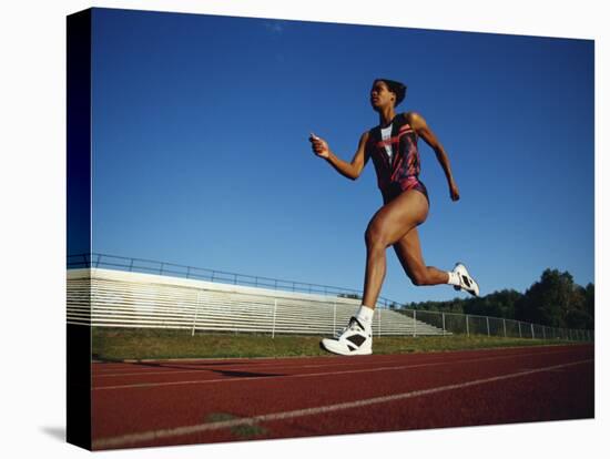 Female Runner Training on the Track-null-Premier Image Canvas