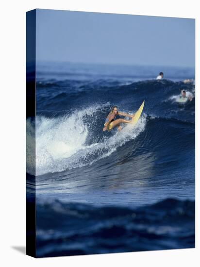 Female Surfer Riding a Wave-null-Premier Image Canvas