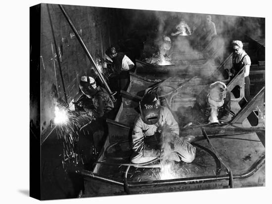 Female Welders Welding Seams on Deck Section of an Aircraft Carrier under Construction at Shipyard-Margaret Bourke-White-Premier Image Canvas