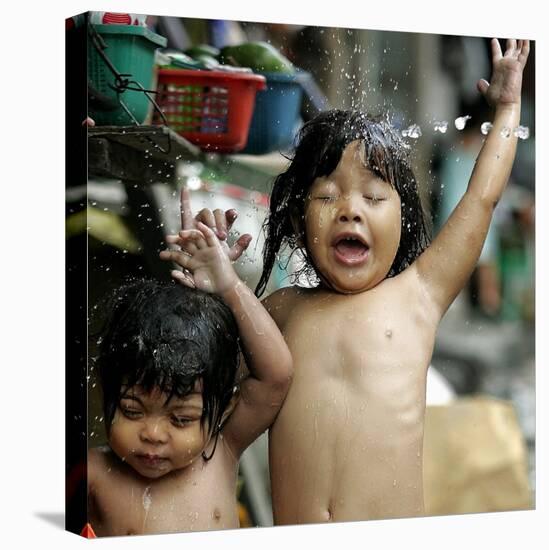 Filipino Children React as They Get a Shower Outside Their Homes-null-Premier Image Canvas