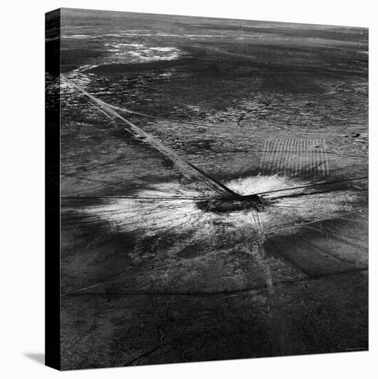 First Atomic Bomb's Dark Crater Surrounded by Glass Created by Heated Sand from Explosion-Fritz Goro-Premier Image Canvas