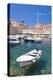 Fishing boat and clear water in the Old Port, Dubrovnik Old Town, Dubrovnik, Dalmatian Coast, Croat-Neale Clark-Premier Image Canvas