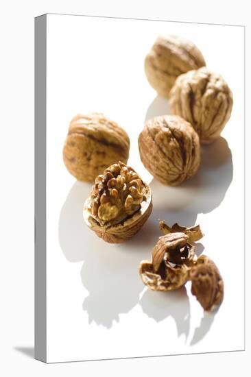 Five Walnuts, Opened and Unopened, on White Background-Kröger and Gross-Premier Image Canvas