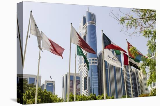Flags in Park and Downtown Skyline of Dubai, United Arab Emirates-Michael DeFreitas-Premier Image Canvas