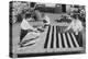 Flags Laid Out on Cutting Table to Be Sewn by Seamstresses During the Period of the Great War-null-Stretched Canvas