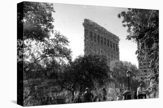 Flatiron Building in NYC Through Reflection in Fountain in Madison Sq. Park-null-Stretched Canvas