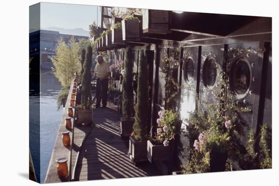 Floating-Home Owner Warren Owen Fonslor Waters the Plants on His Deck, Sausalito, CA, 1971-Michael Rougier-Premier Image Canvas