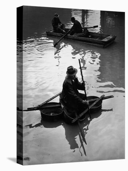 Flood Victim Paddling Boat Fashioned Out of Four Washtubs in the Flood Waters of Mississippi River-Margaret Bourke-White-Premier Image Canvas