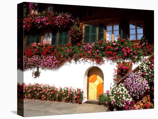 Flowers and Chalet in the Resort Area, Gstaad, Switzerland-Bill Bachmann-Premier Image Canvas