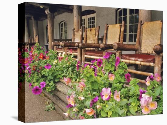 Flowers and Wooden Chairs at Lake McDonald Lodge, Glacier National Park, Montana, USA-Chuck Haney-Premier Image Canvas