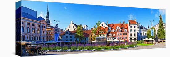 Flowers in a Garden with Buildings in the Background, Riga, Latvia-null-Stretched Canvas