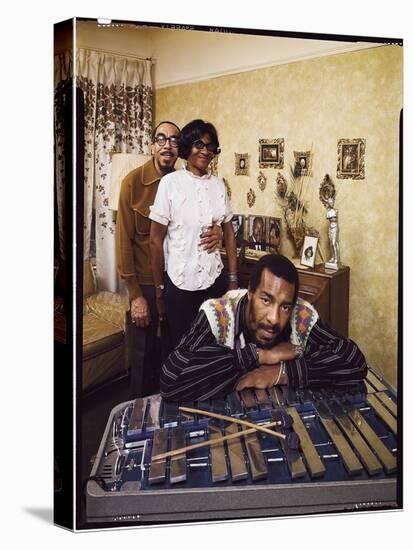 Folk Singer Richie Havens Leaning on Xylophone with Parents: Richard and Mildred in Background-John Olson-Premier Image Canvas