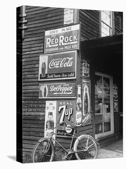 Food Store Called Leo's Place Covered with Beverage Ads Incl. Coca Cola, 7 Up, Dr. Pepper and Pepsi-Alfred Eisenstaedt-Premier Image Canvas