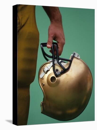 Football Player Holding His Helmet-Chris Trotman-Premier Image Canvas