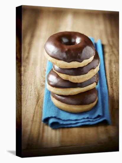 Four Doughnuts with Chocolate Glaze, Stacked-Michael Löffler-Premier Image Canvas