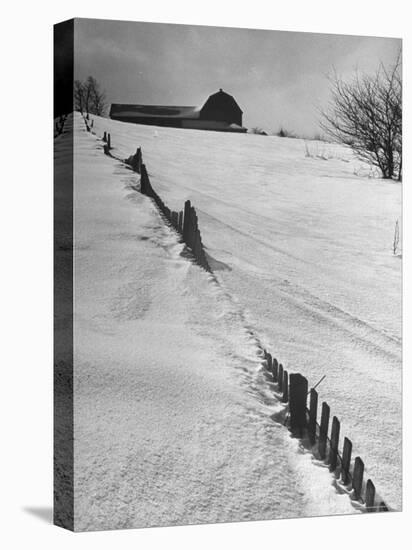 Four Ft. of Snow Almost Covering Up Snow Fence in Front of Barn on the Hill on Upstate Farm-Andreas Feininger-Premier Image Canvas