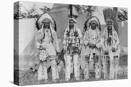 Four Native American Chiefs in Traditional Clothing and Feathered Bonnet-null-Stretched Canvas