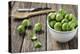 Fresh Brussels Sprouts in White Bowl on Wooden Table-Jana Ihle-Premier Image Canvas