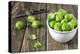 Fresh Brussels Sprouts in White on Wooden Table-Jana Ihle-Premier Image Canvas
