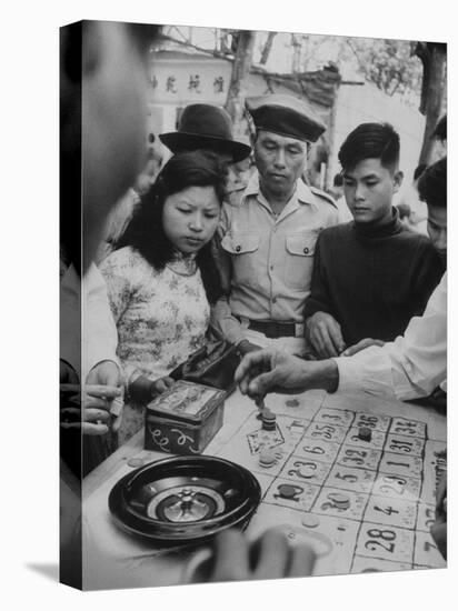 Game of Roulette at Fair in Central Highlands Celebrating New Year's Holiday-John Dominis-Premier Image Canvas