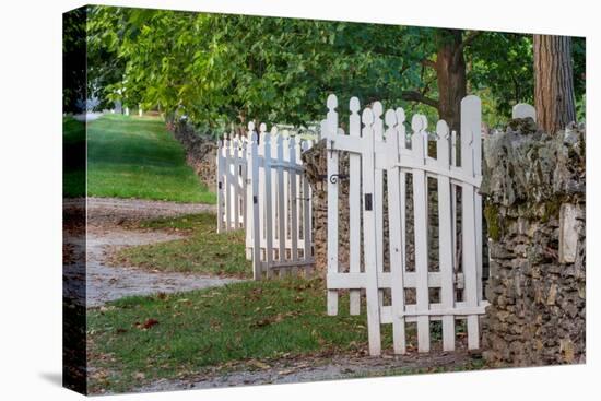 Gate and white wooden fence and rock wall, Shaker Village of Pleasant Hill, Harrodsburg, Kentucky-Adam Jones-Premier Image Canvas