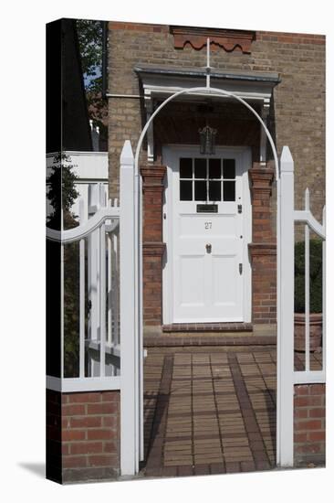 Gates Leading to Block Paving, and a White Front Door, of a Residential House-Natalie Tepper-Stretched Canvas
