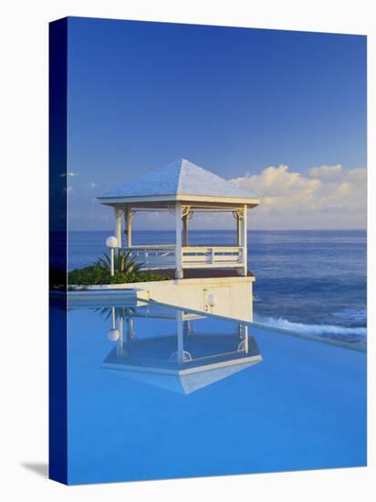 Gazebo Reflecting on Pool with Sea in Background, Long Island, Bahamas-Kent Foster-Premier Image Canvas