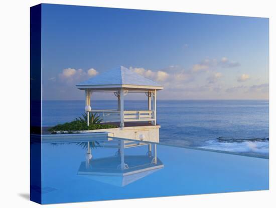 Gazebo Reflecting on Pool with Sea in Background, Long Island, Bahamas-Kent Foster-Premier Image Canvas