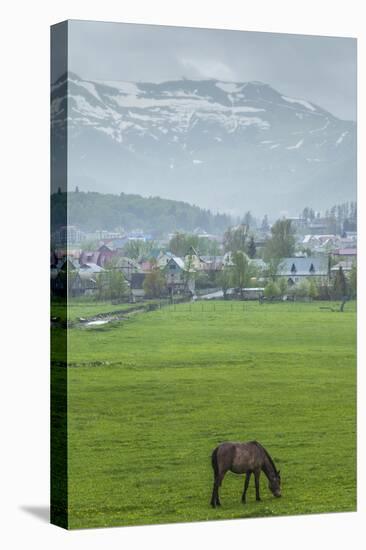 Georgia, Bakuriani. Ski resort town, view of town and mountains.-Walter Bibikow-Premier Image Canvas