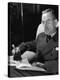 German Born Novelist Thomas Mann Sitting in Armchair at Home, Smoking Cigar and Reading a Book-Carl Mydans-Premier Image Canvas