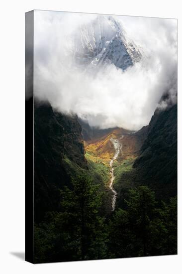 Giant mountain emerging through the clouds in the Himalayas, Nepal on the way to Everest Base Camp-David Chang-Premier Image Canvas