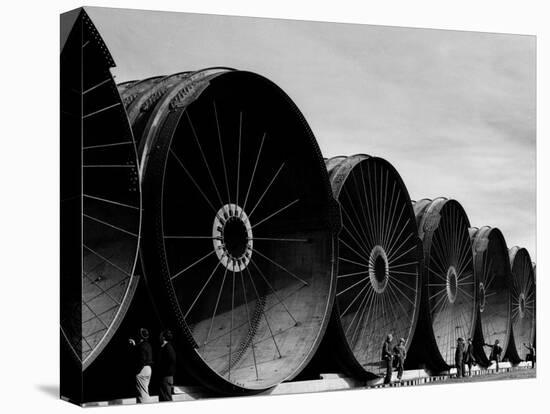 Gigantic Pipe Segments Used for Diverting the Missouri River During Construction of Fort Peck Dam-Margaret Bourke-White-Premier Image Canvas