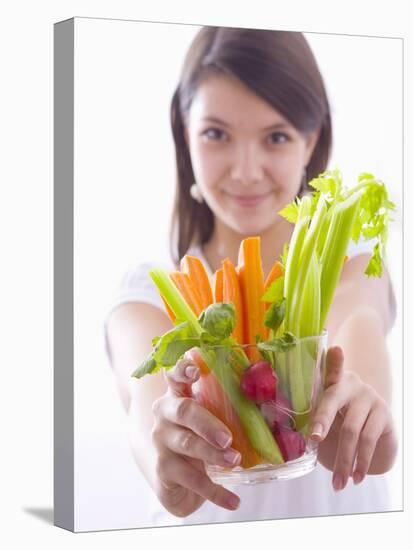 Girl Holding a Bowl of Vegetable Sticks with Radishes-null-Premier Image Canvas