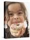 Girl Holding a Doughnut with Sprinkles, Partly Eaten-null-Premier Image Canvas