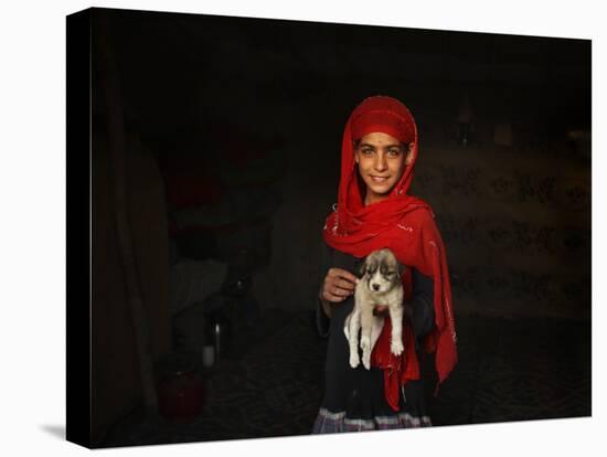 Girl Holds a Puppy as the Sun Sets over Kabul's Impoverished Teppe Maranjan Neighborhood-null-Premier Image Canvas