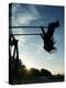 Girl Playing High on Swings at Sunset on Vosu Beach, Located in Lahemaa National Park-Christian Kober-Premier Image Canvas