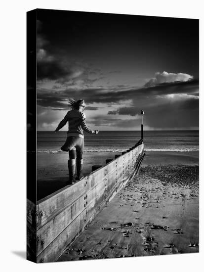 Girl Walking on Sea Defence-Rory Garforth-Premier Image Canvas
