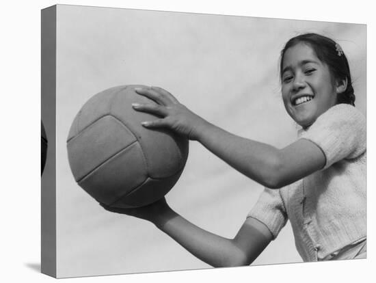 Girl with volley ball, Manzanar Relocation Center, 1943-Ansel Adams-Premier Image Canvas