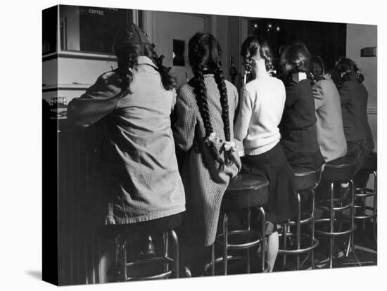 Girls Known as "Pigtailers" Sitting on Stools at Soda Fountain-Frank Scherschel-Premier Image Canvas