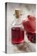 Glass Bottle with Pomegranate Juice and Pomegranate-Jana Ihle-Premier Image Canvas