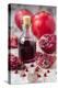 Glass Bottle with Pomegranate Juice and Pomegranates-Jana Ihle-Premier Image Canvas