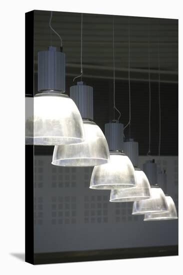 Glass Pendant Lights Hanging in a Row-David Barbour-Stretched Canvas