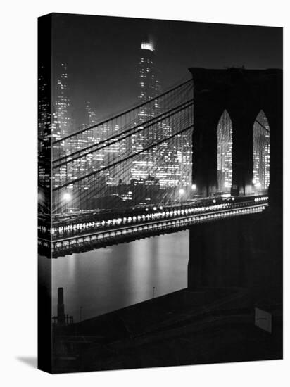 Glittering Night View of the Brooklyn Bridge Spanning the Glassy Waters of the East River-Andreas Feininger-Premier Image Canvas